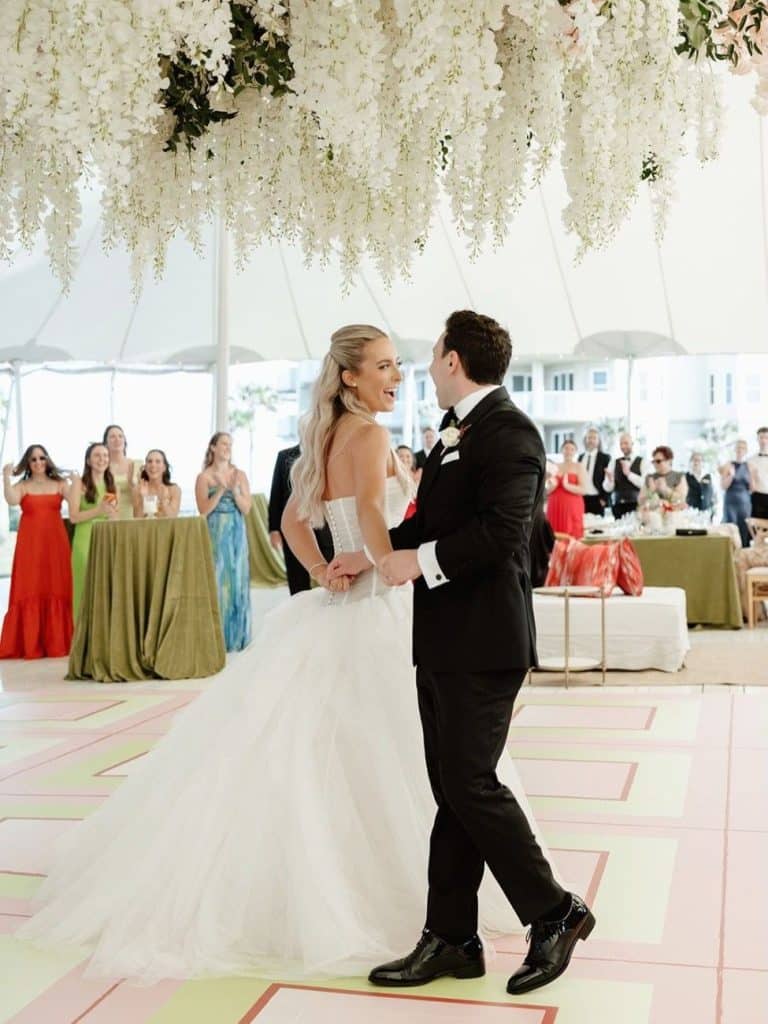bride and groom on custom color-block outdoor wedding dance floor