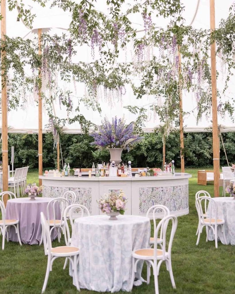 custom wrapped wedding bar and event graphics under outdoor tent